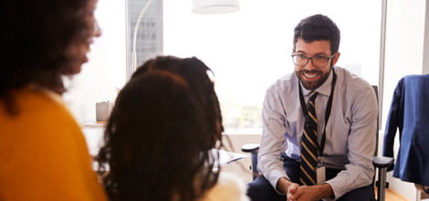 Consultation between a doctor and patient with her daughter